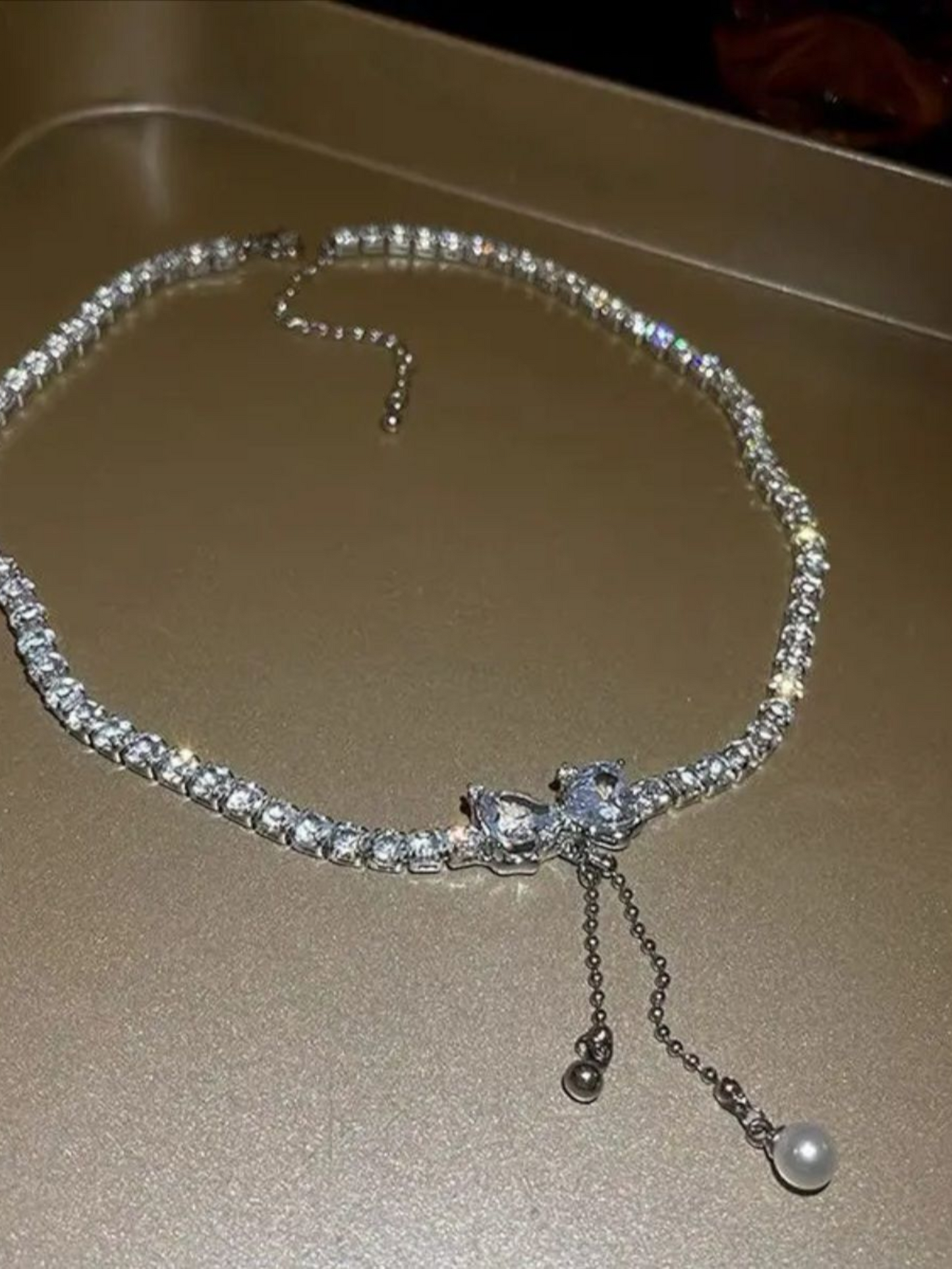 Shimmering Rhinestones Tassel Drop Bow Necklace