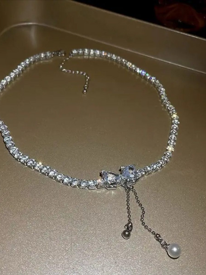 Shimmering Rhinestones Tassel Drop Bow Necklace