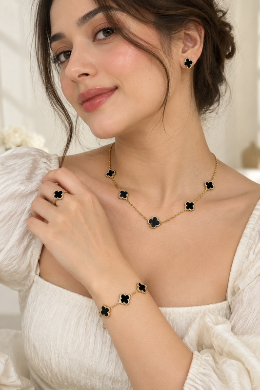 Clover Motif 4-Piece Jewelry Set: Black And Gold-Tone Necklace, Bracelet, Earrings, and Ring Combo